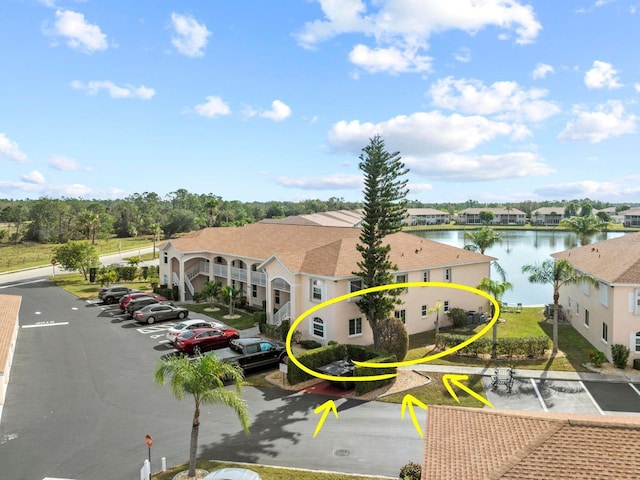 birds eye view of property featuring a water view