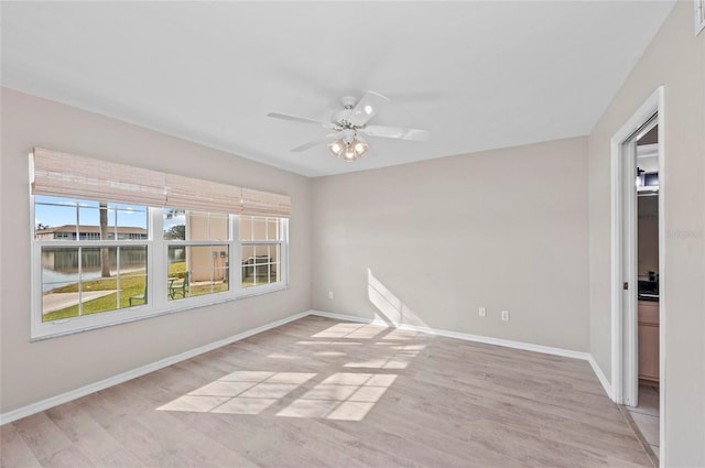 empty room with light hardwood / wood-style floors and ceiling fan