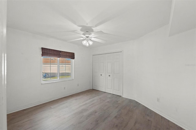 unfurnished bedroom with ceiling fan, light wood-type flooring, and a closet