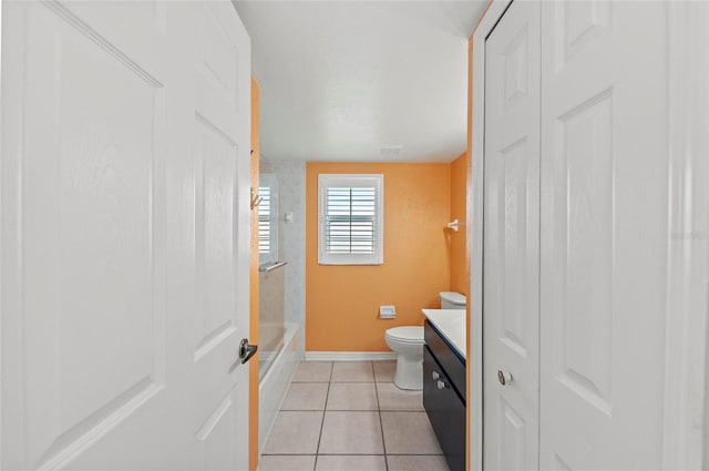 full bathroom with vanity, bathing tub / shower combination, tile patterned floors, and toilet