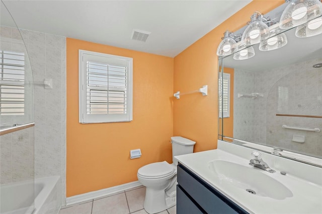 full bathroom featuring tile patterned flooring, vanity, tiled shower / bath combo, toilet, and plenty of natural light