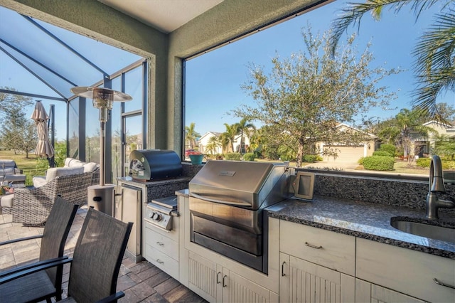 view of patio / terrace with area for grilling, exterior kitchen, and sink