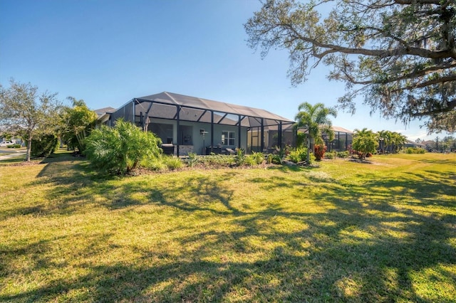 view of yard with glass enclosure