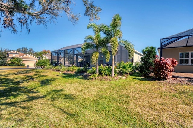 view of yard featuring glass enclosure