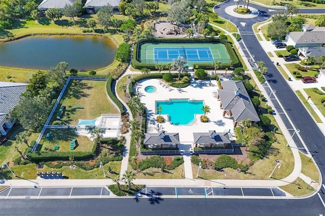 birds eye view of property featuring a water view