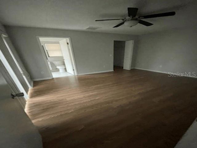 empty room featuring hardwood / wood-style floors and ceiling fan