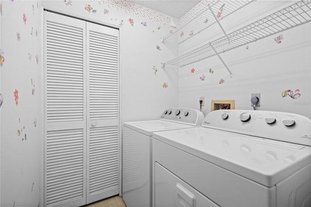 washroom featuring washer and clothes dryer