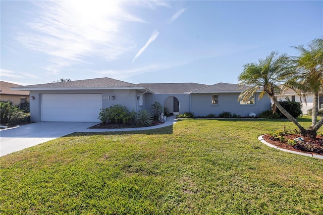 single story home with a garage and a front lawn