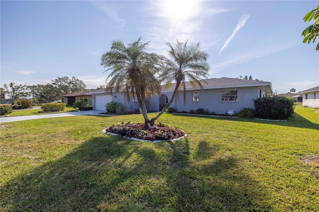 single story home featuring a garage and a front lawn