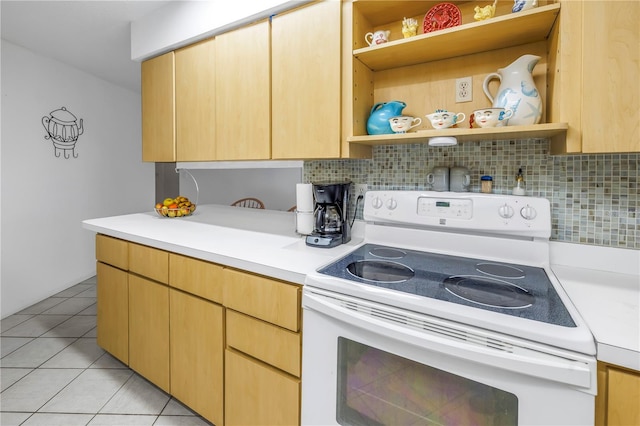 kitchen with tasteful backsplash, light tile patterned floors, light brown cabinets, and white range with electric stovetop