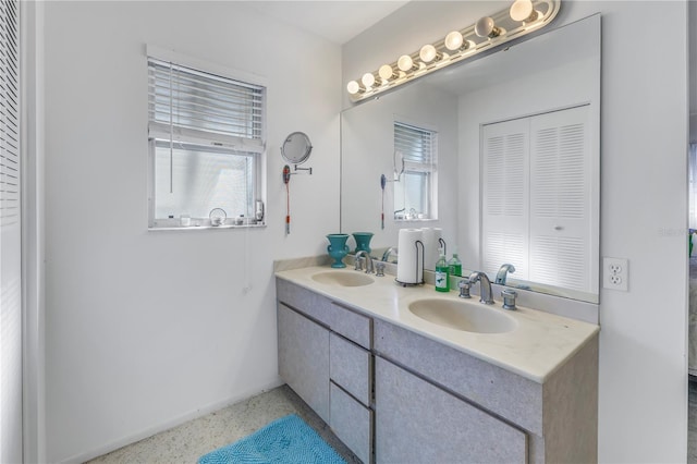 bathroom with vanity and plenty of natural light