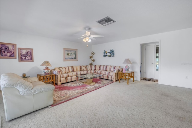 living room featuring ceiling fan and carpet flooring