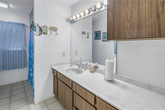 bathroom featuring tile patterned flooring and vanity