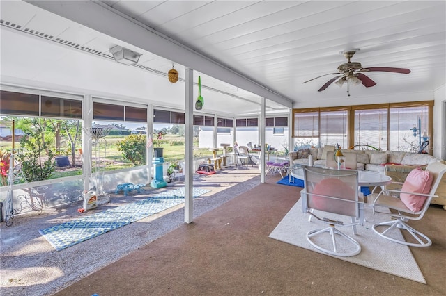 sunroom / solarium with ceiling fan and a healthy amount of sunlight