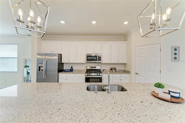 kitchen featuring white cabinetry, sink, stainless steel appliances, crown molding, and light stone countertops