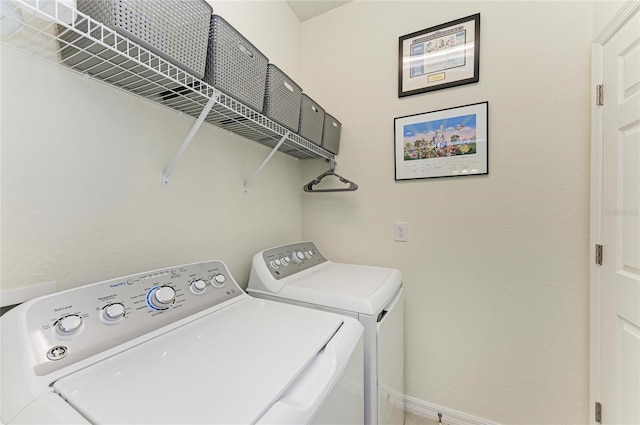 laundry area with separate washer and dryer