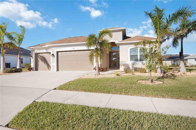 view of front of property featuring a garage and a front yard