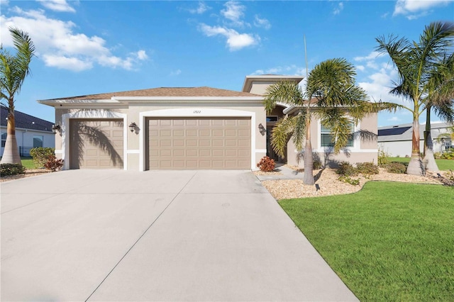 view of front of house with a garage and a front lawn