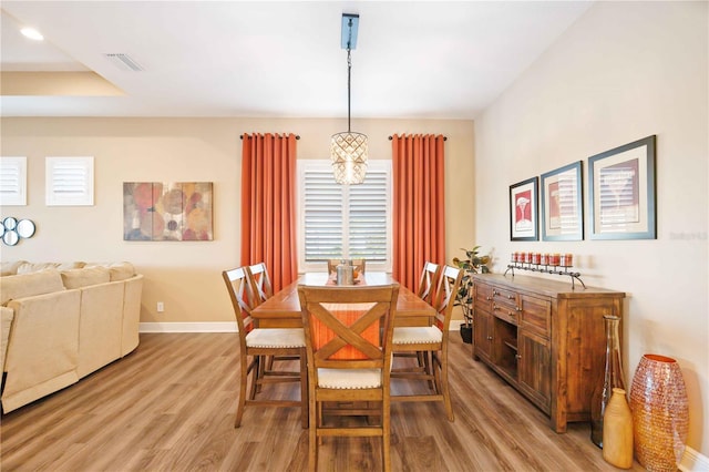 dining area featuring light wood-type flooring