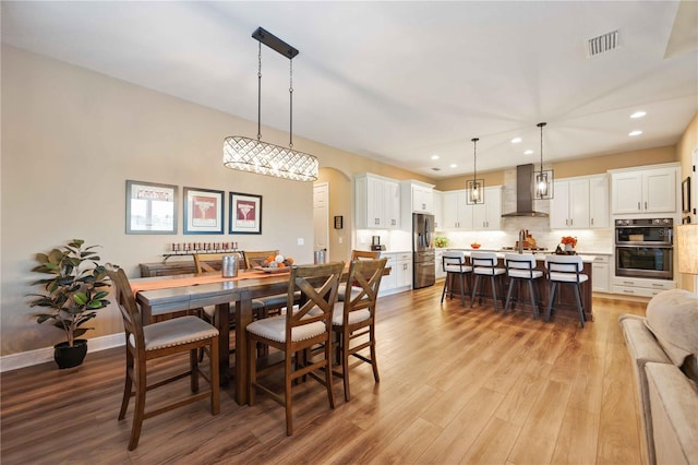 dining room with light hardwood / wood-style flooring