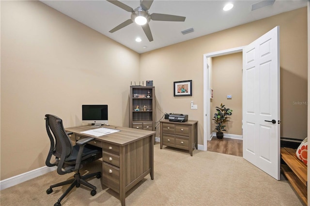 office space featuring ceiling fan and light carpet