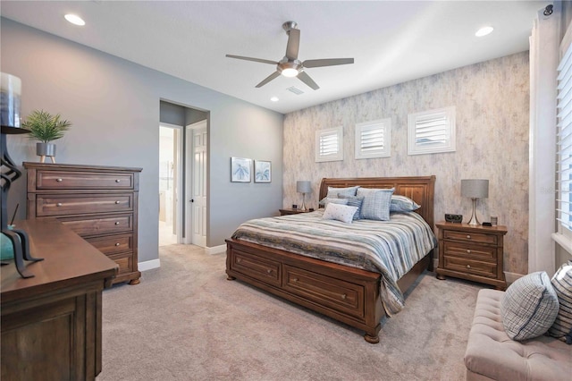 bedroom featuring ceiling fan and light carpet