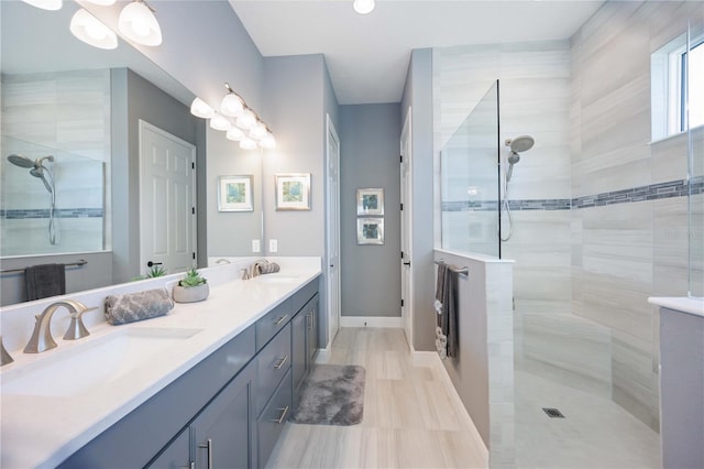 bathroom featuring vanity and a tile shower