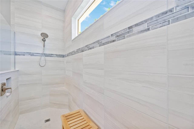 bathroom with tiled shower