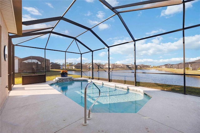 view of swimming pool featuring a patio, a water view, and glass enclosure