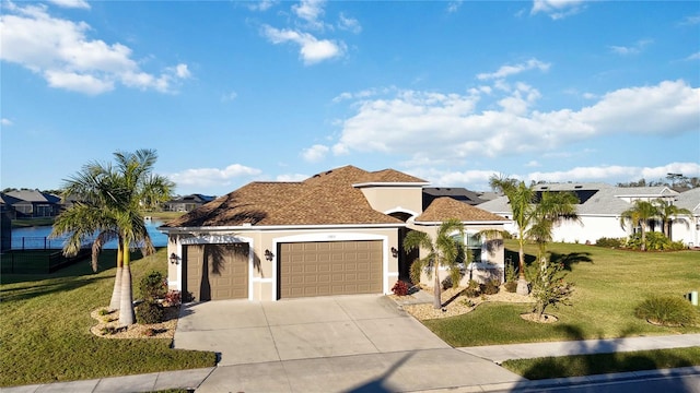 mediterranean / spanish home with a garage and a front yard