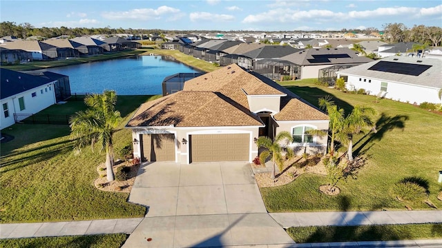 drone / aerial view with a water view