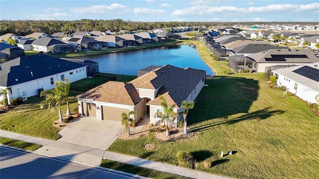 drone / aerial view with a water view