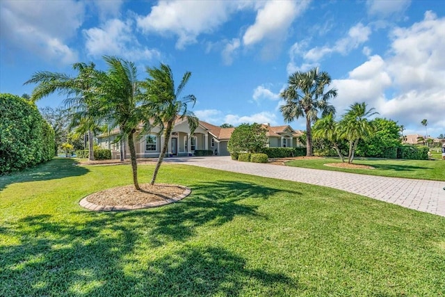 exterior space featuring decorative driveway