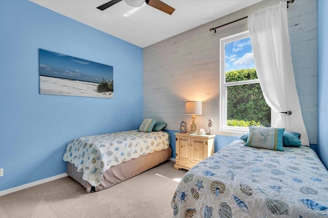 bedroom featuring carpet, a ceiling fan, and baseboards