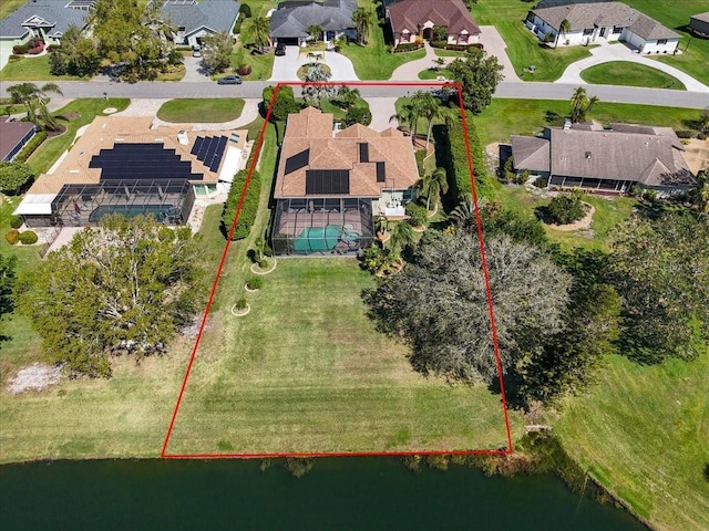 birds eye view of property featuring a residential view and a water view