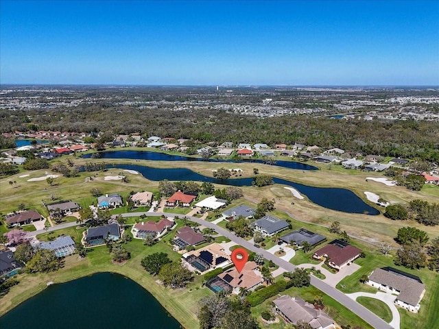 drone / aerial view featuring a water view and golf course view