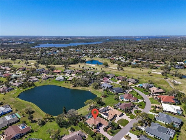 birds eye view of property featuring a residential view and a water view