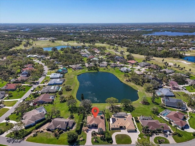 birds eye view of property with a water view and a residential view