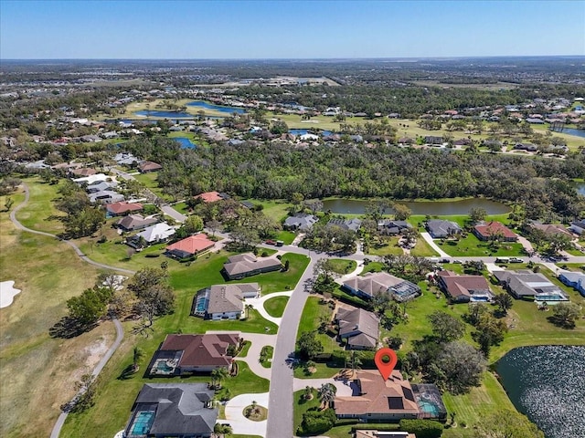 birds eye view of property with a water view and a residential view