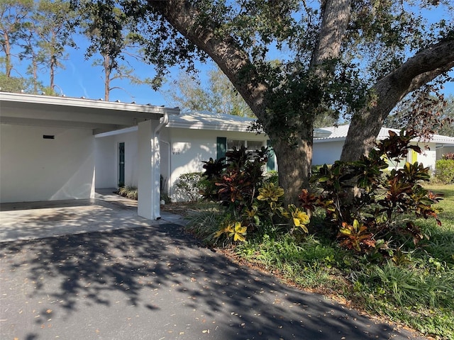 view of front of property with a carport