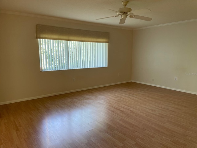 spare room with ornamental molding, hardwood / wood-style floors, and ceiling fan