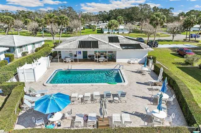 view of swimming pool with a patio