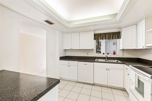 kitchen with sink, white cabinets, and white appliances