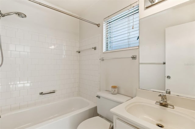 full bathroom featuring tiled shower / bath combo, vanity, and toilet