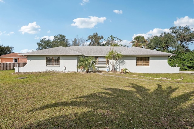 ranch-style home with a front lawn