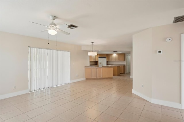 unfurnished living room with light tile patterned floors and ceiling fan