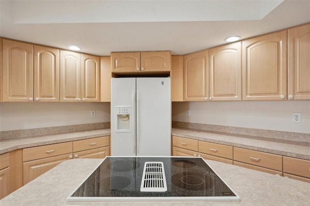 kitchen with black electric cooktop, light brown cabinetry, and white fridge with ice dispenser