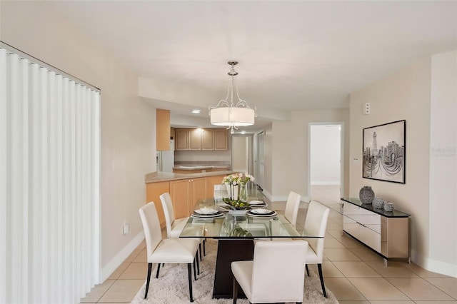 dining area featuring light tile patterned floors