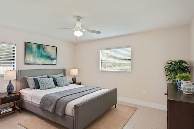 bedroom with light tile patterned flooring and ceiling fan