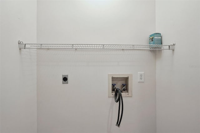 washroom with hookup for a washing machine and hookup for an electric dryer